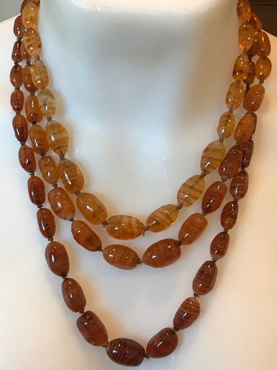 beautiful three stranded vintage Amber and gold glass beaded necklace circa 1950s