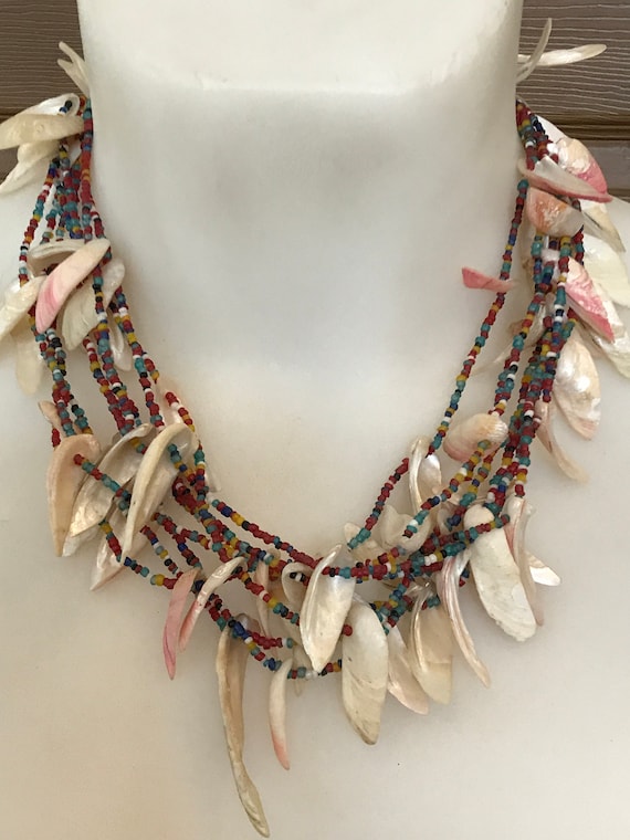 Unusual vintage tribal style multi strand seed beaded necklace with shell fringe