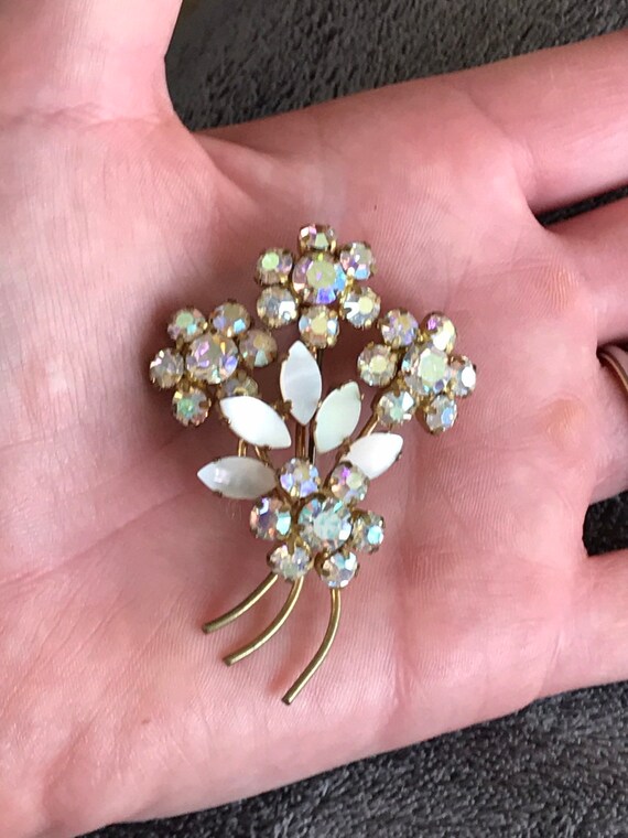 Sparkling 1950s white rhinestone and mother of pearl floral bouquet brooch