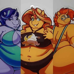 May include: Three cartoon characters with pony-like features. The first is purple with a teal swimsuit. The second is orange with a black swimsuit with a white and yellow design. The third is orange with glasses and a blue strap.