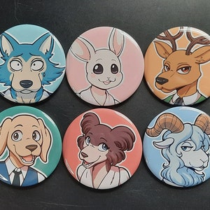 May include: Six round pinback buttons featuring anime-style animal characters. Each button has a different character, including a wolf, rabbit, deer, dog, bear, and ram. The buttons have a glossy finish and are set against a dark background.