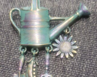 Vintage green and gold metal patina watering can and garden motif charms brooch