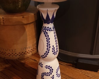 Upcycled ceramic bottle and plate into bird feeder or bath