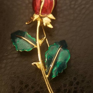 Vintage gold tone metal, red and green enamel Rose stem Brooch