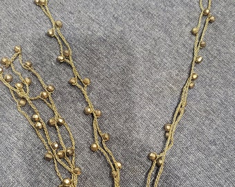 Vintage crocheted gold chain with plastic gold beads long necklace