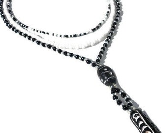 Multistrand necklace with black, white and silver-coloured glass beads, seed beads. Handcrafted collar, layered necklace with ceramic beads