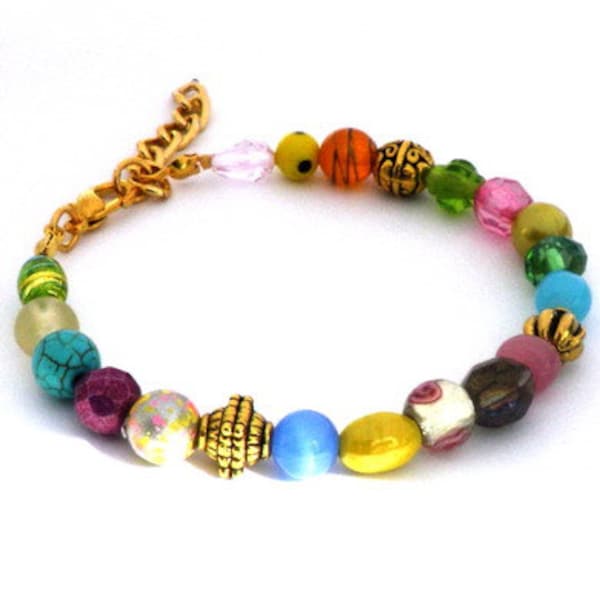 Bracelet with multi-coloured beads and goldplated beads. Handmade wristband, beads glass, ceramic, tiger eye, gold colored, Per Elle jewelry