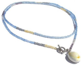 Necklace blue and beige glass beads. Handcrafted minimalist necklace, toggle clasp front side with cowrie shell pendant, seed beaded collar