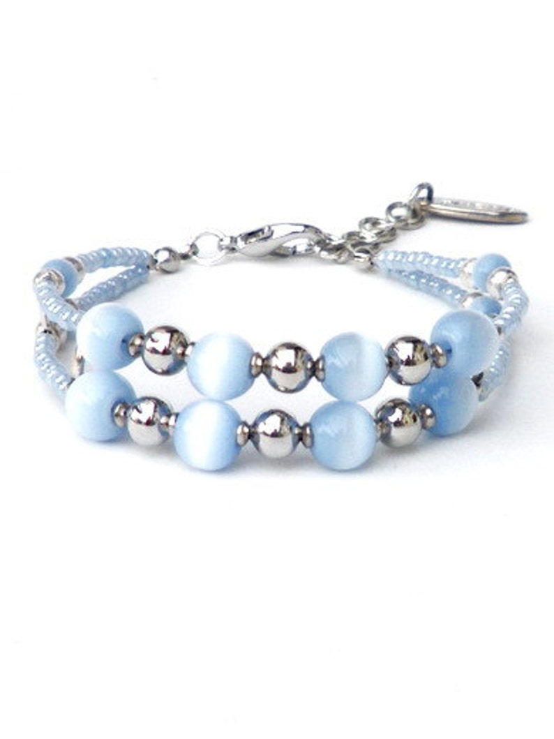 Blue bracelet with ice blue cat's eye beads and seed image 0