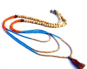 Hippie necklace turquoise, orange, beige seed beads. Handcrafted collar with cotton tassel, layering necklace, triple strand, wooden beads