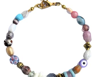 Bracelet with white coral branches, pastel-color beads. Handcrafted wristlet Ibiza, bead from glass, shell, coral stick, evil eye, gemstone