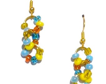 Handmade Beaded Earrings with gold-tone rings paired with glass beads – Gold-colored ear hooks – Each pair crafted by hand = unique earrings