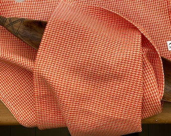 100% cotton handwoven dishcloth. Houndstooth pattern, orange and  white . Hand woven on traditional loom