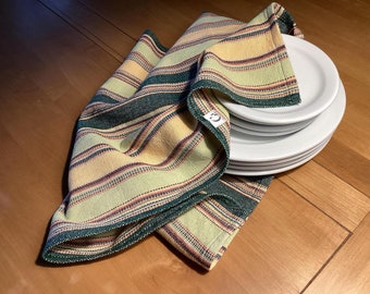 100% cotton handwoven dishcloth , stripes green and yellow . Pattern with blue and multicolored stripes. Hand woven on a traditional loom.