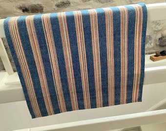 100% cotton handwoven dishcloth with stripes blue  and rainbow.Pattern with blue and multicolored stripes. Hand woven on a traditional loom.