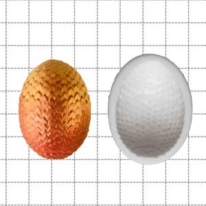 May include: Two round silicone molds, one with a textured surface and one with a smooth surface. The textured mold is orange and the smooth mold is white. The molds are 1 inch in diameter.