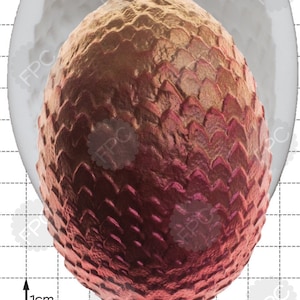 Może przedstawiać: Forma silikonowa do pieczenia ciasta w kształcie smoka. Forma jest biała i ma fakturowaną powierzchnię. Forma ma średnicę 1 cm.