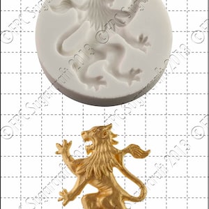 May include: A silicone mold for baking a lion shaped cake decoration. The mold is white and shows a detailed lion with a mane. A gold lion cake decoration is shown next to the mold for size comparison. The decoration is 1 cm tall.
