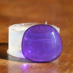 A transparent silicone mold for jewellery Diy, cabochon pebble shape , 27/25mm