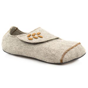 May include: Gray felt slippers with a brown leather strap and decorative stitching. The strap has a brown leather flower design.