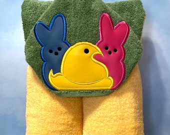 Hooded Towel with an embroidered character on it.
