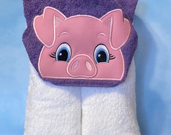 Hooded Towel with an embroidered character on it.