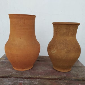 Old antique ancient clay vessel vase without handle. Brown clay pot. Rustic bowl. Primitive decor. Country decor