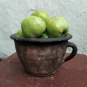 Old antique ancient clay vessel vase with handle. Brown clay pot. Rustic bowl. Primitive decor. Country decor