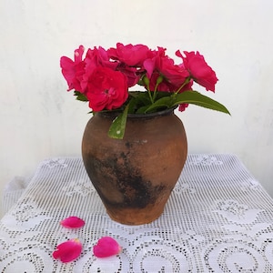 Very old antique ancient clay vessel. Brown clay pot without handle. Rustic bowl. Primitive decor. Country decor