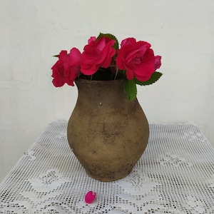 Very old antique ancient clay vessel. Brown clay pot without handle. Rustic bowl. Primitive decor. Country decor. Ceramics, pottery