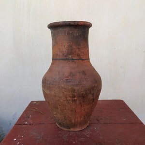Very old antique ancient clay vessel. Brown clay pot. Rustic bowl. Primitive decor. Country decor. Ceramics, pottery