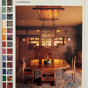 May include: The cover of "The Abrams Guide to Period Styles for Interiors" book. The book features a photograph of a dining room with a large wooden table, chairs, and cabinetry. The text on the cover reads "The Abrams Guide to Period Styles for Interiors" by Judith Gura.