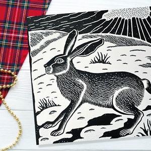 Carte linogravure lièvre noir et blanc paysage d'hiver enneigé scène de neige montagnes rétro ciel salutations pour les amis de la famille Noël 2025 Merci