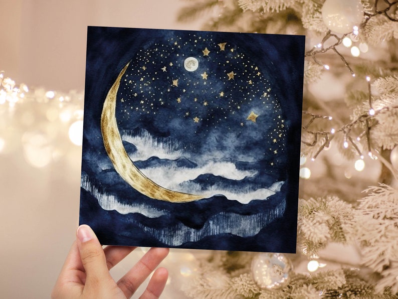 May include: A watercolour painting of a crescent moon with gold accents against a dark blue night sky with white clouds and gold stars.