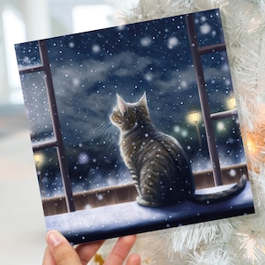 Cat Christmas Card Cute Kitten Watching Snow Fall Tabby Snowy Window Winter Night Scene Falling Whimsical Greetings Family Friends Xmas 2023 image 1