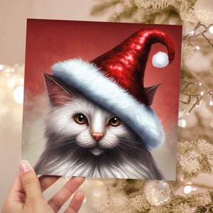 Witte kat kerstkaart langharige kat met schattige rode kerstmuts feestelijk met amberkleurige ogen wenskaarten voor familie vrienden Kerstmis 2025