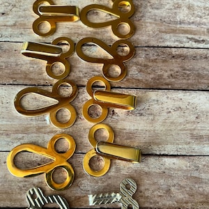 Buckle,Vintage  ladies belt buckles. Gold tone metal.Set of six