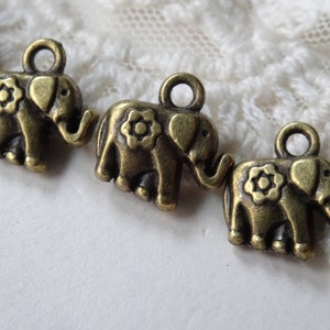 8- Bohemian Elephant Charms Flower Wearing Pachyderm Charm Floral Elephant Supplies Inv0147
