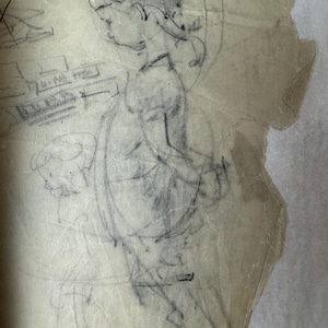 May include: A pencil sketch of a person wearing a hat and holding a cup. The drawing is on a piece of paper with a torn edge.