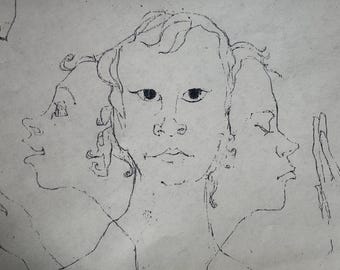 May include: A black and white sketch of a face with three overlapping profiles. The central face is frontal, while the other two are in profile. The artwork is a line drawing on a light-colored background.