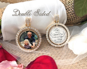 May include: Double-sided gold-tone pendant with a clear crystal border. One side features a photo of a man and a girl. The other side has a message that reads "Lapi, On this Special Day I will miss you the Most. 11.05.2023".