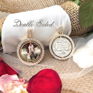 May include: Double-sided gold charm with a clear crystal border. One side features a photo of a father and daughter walking. The other side has a message that reads "On this special day know that I am here walking you down the aisle my beautiful daughter my Lillie. 6.12.2023".