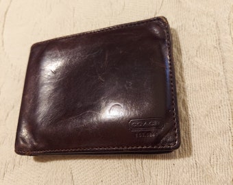 Vintage Coach brown leather mens bifold wallet.