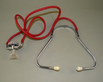 Estetoscopio antiguo de médico vintage con cabezal giratorio doble, años 60