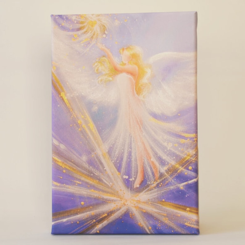 May include: A painting of an angel with white wings and a white dress, reaching up towards a golden star. The background is a purple and gold abstract design.