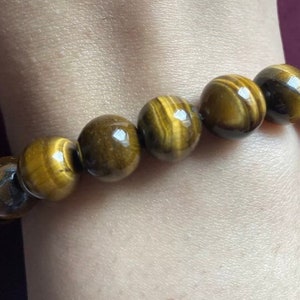Runde Tiger Auge dehnbare Perle Armband. Freie Größe