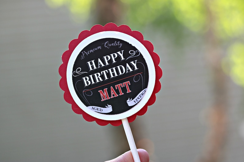 May include: Red and white round cake topper with black text that says "Premium Quality Happy Birthday Matt Aced Vintage".