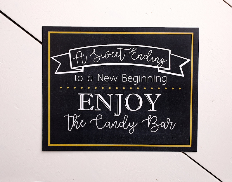 May include: A black chalkboard sign with a gold border and white text that reads "A Sweet Ending to a New Beginning... ENJOY the Candy Bar".