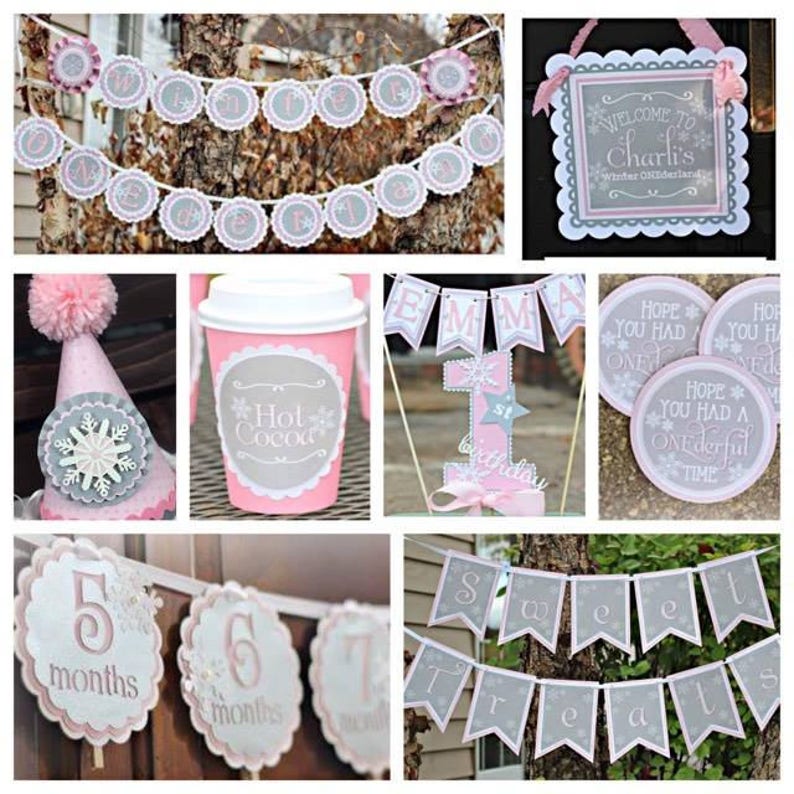 May include: Winter wonderland themed party decorations with a gray and pink color scheme. The decorations include a banner that says "Welcome to Charli's Winter Wonderland", a banner that says "Sweet Treats", a banner that says "Emma", a hot cocoa cup, a snowflake party hat, and a cake topper with a snowflake and the number one.