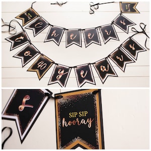 May include: Black and gold banner with the words "Cheers to 40 years" and a separate black and gold sign that says "Sip Sip Hooray".